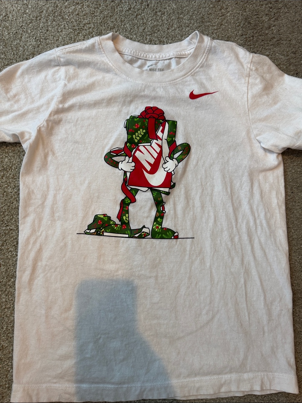 Nike White Tee with Red Swoosh and Green Gift Graphic